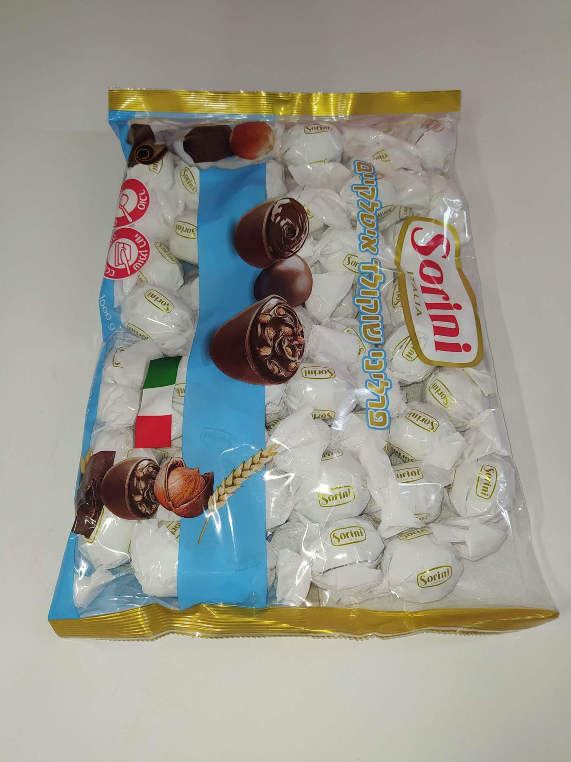 שוקולד איטלקי סוריני פרטה חלב נוגט אגוזים עטיפה לבנה 1 ק”ג